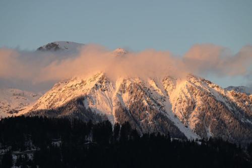 a mountain covered in snow and clouds at s´Bergnestle in Bad Hindelang