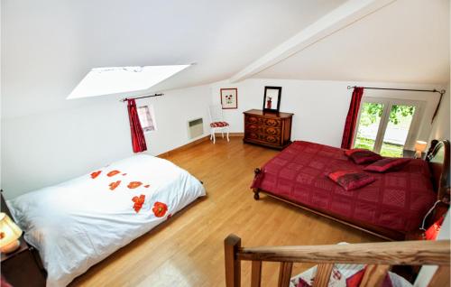 a bedroom with a bed and a table and a window at Beautiful Home In Loriol-Sur-Drôme in Loriol-sur-Drôme