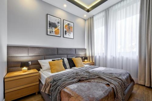 Postel nebo postele na pokoji v ubytování Aparthotel Góralski Spa & Restaurant