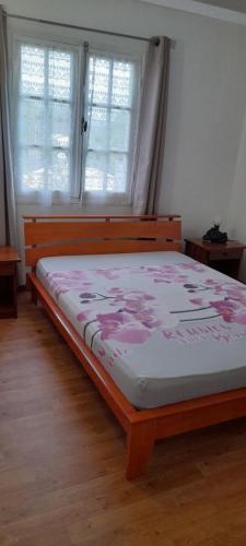 Postel nebo postele na pokoji v ubytování Chez Gilou