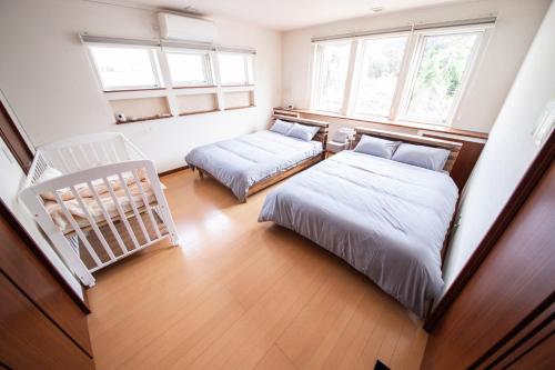 Postel nebo postele na pokoji v ubytování THE VILLA FURANO【Wide Horizon】