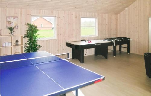 a ping pong room with two ping pong tables at Stunning Home In Idestrup With Wifi in Marielyst