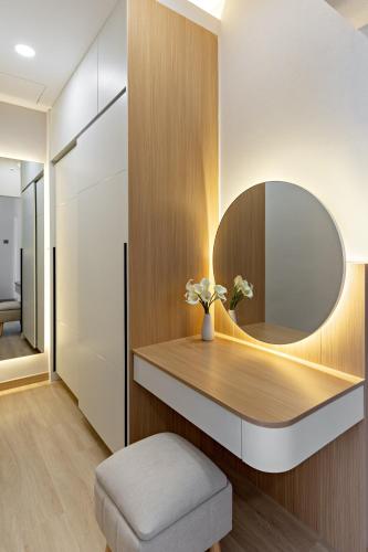 a dressing room with a mirror and a stool at Newly Renovated 2BR Apt and Direct Mall Access in Jakarta