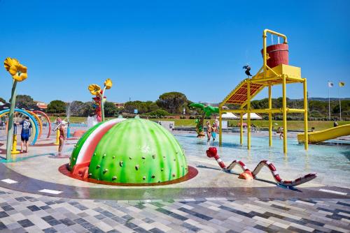 a water park with a water slide and a water park at Glamping Aglientu in Vignola Mare
