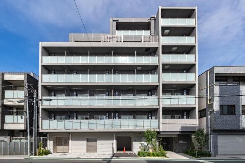 an apartment building with a lot of windows at Dash Living Asakusa East in Tokyo