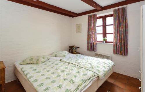 Ein Bett oder Betten in einem Zimmer der Unterkunft Birknæsgård