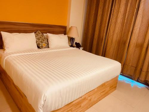 Una cama o camas en una habitación de The Grand View