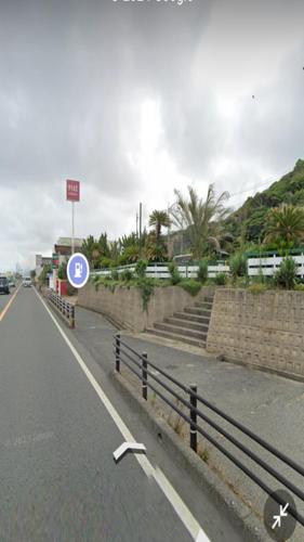 a street with a sign on the side of the road at Pension Le Passage - Vacation STAY 11300v in Tottori