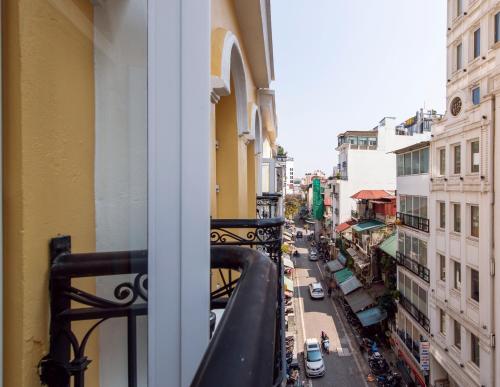 a view of a city street from a balcony at Hanoi Tirant Hotel in Hanoi