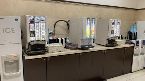 a counter in a room with machines on it at Toyoko Inn Tokyo Shinagawa Konan-guchi Tennozu Isle in Tokyo