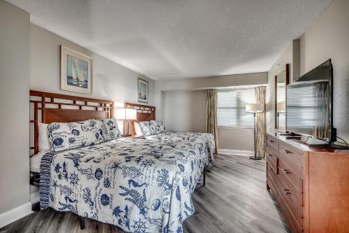 En eller flere senge i et værelse på Dunes Village Resort 1253