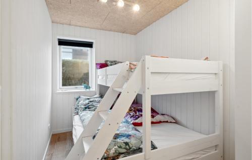a white bunk bed in a white room at Awesome Home In Otterup With Jacuzzi in Otterup