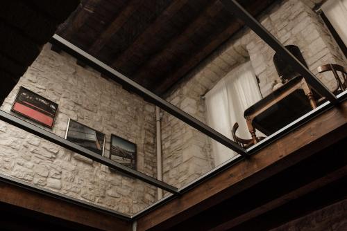 a window in a stone building with at V1 Loft - Luxury Suite con tetto di vetro a due passi dal mare in Molfetta