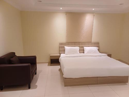 Postel nebo postele na pokoji v ubytování Al tawfeeg hotel - Al Azizyah