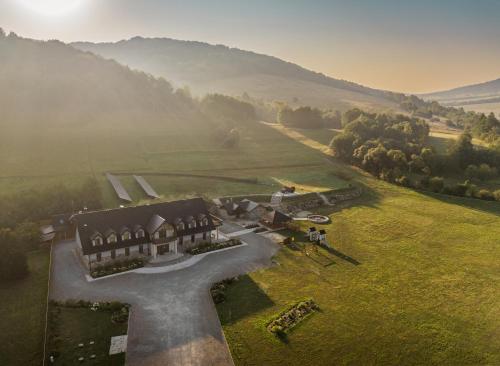 an aerial view of a house in a field at Bacówka Polany in Polany
