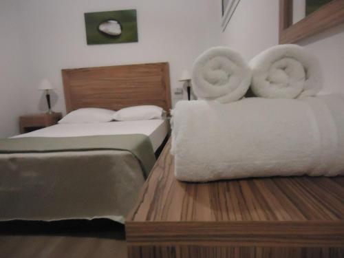 Ένα ή περισσότερα κρεβάτια σε δωμάτιο στο Ayres Sur