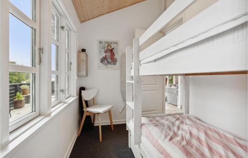 a bedroom with a bunk bed and a desk and window at Gorgeous Home In Børkop With Kitchen in Børkop