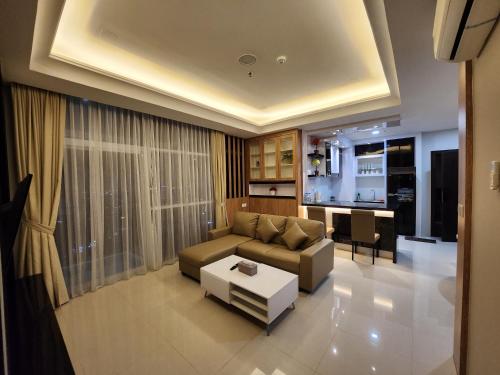 a living room with a couch and a table at Cozy Apartment 26TH with Seaview in Nagoya
