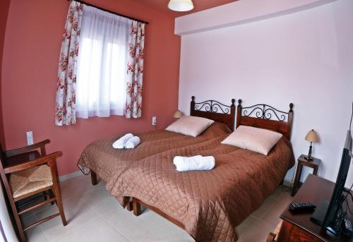 Ένα ή περισσότερα κρεβάτια σε δωμάτιο στο Maison Kronio Lassithi Plateau