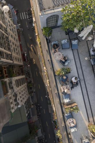 an overhead view of a city street with tables and buildings at Hanoi Tirant Hotel in Hanoi