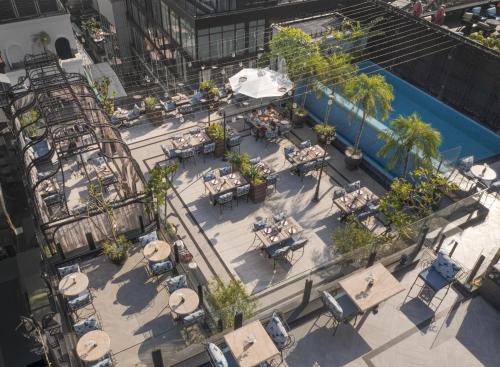 an overhead view of a patio with tables and chairs at Hanoi Tirant Hotel in Hanoi