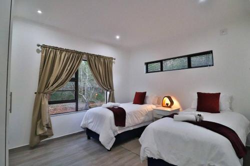 Ένα ή περισσότερα κρεβάτια σε δωμάτιο στο Krokodil Rus