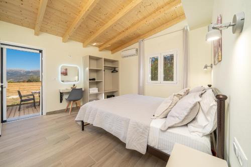 a bedroom with a bed and a desk and a window at Lakithra Comfort Cove in Lakithra