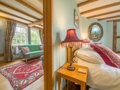 Ένα ή περισσότερα κρεβάτια σε δωμάτιο στο Bearwood House & Cottage