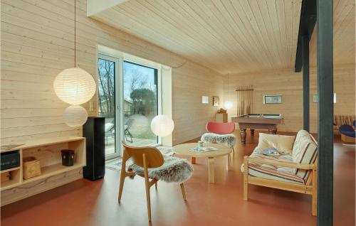 a living room with a couch and a table at Amazing Home In Sejerø With Kitchen in Sejerby
