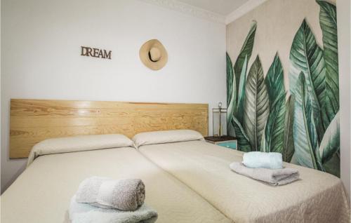 a bedroom with a bed with towels on it at Pet Friendly Home In Malaga in Málaga