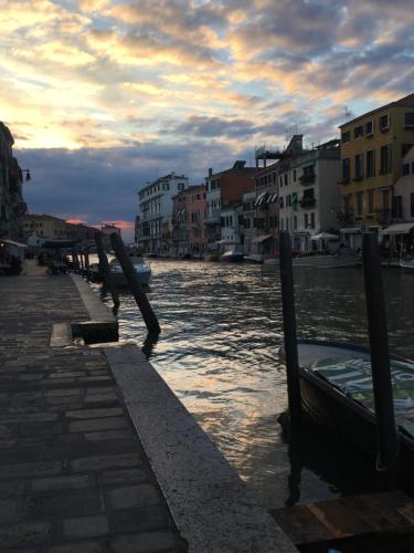 a view of a river with buildings and a bridge at Ca' Bonfadini Historic Experience in Venice