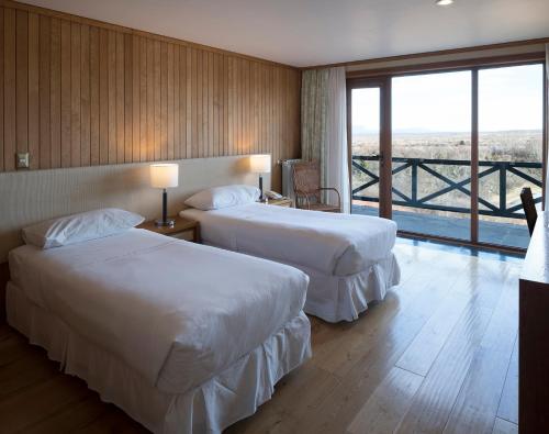 Postel nebo postele na pokoji v ubytování Hotel y Cabañas Llanuras de Diana - Caja Los Andes