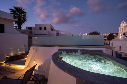 a hot tub on the roof of a building at NEW Yiota Collection 4 Suites & 4 Prive Jacuzzi in Megalokhori