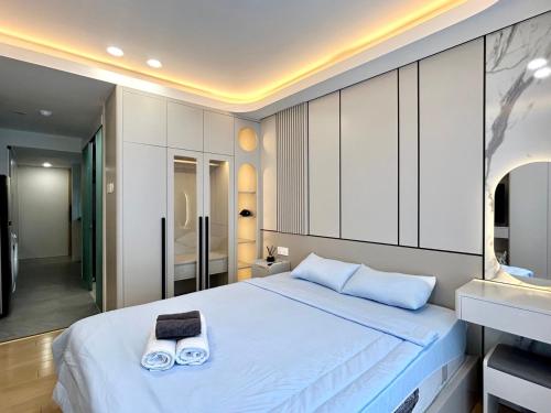 Postel nebo postele na pokoji v ubytování HOD Apartment Tan Dinh