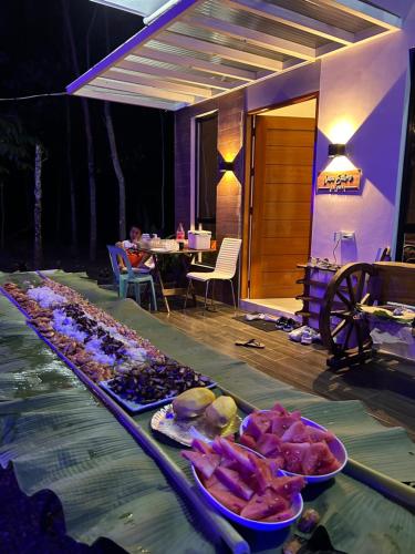 a buffet of food on a table in a restaurant at Tagaytay's Cozy Loft-type Forest House and Camp in Silang