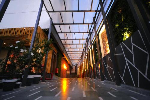 a hallway of a building with a glass ceiling at Imperial Heights in Deoghar