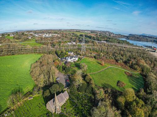 an aerial view of a vineyard with a house and trees at Snowdonia View in Llanfairpwllgwyngyll