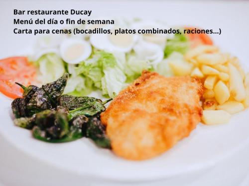 a white plate of food with vegetables and meat at Hotel Rooms Ducay in Olite