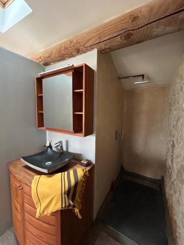 a bathroom with a sink and a mirror at La Grange du Barroux in Le Barroux