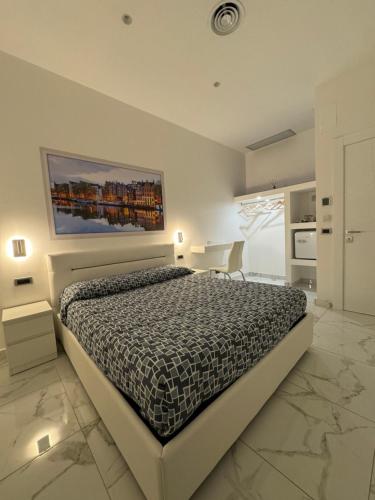Postel nebo postele na pokoji v ubytování B&B Rossini Luxury 3