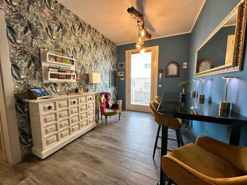 a living room with a white dresser and a table at AlCivico3 in Civitanova Marche
