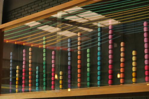 a display case with colorful chutes at Navela Hotel & Convention in Ratchaburi
