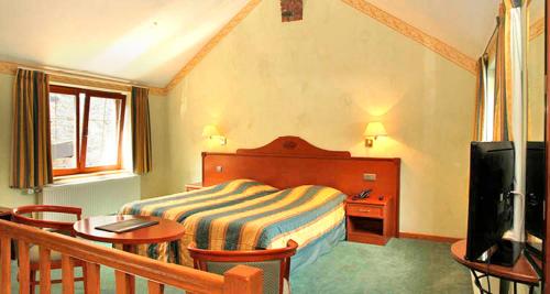 Ένα ή περισσότερα κρεβάτια σε δωμάτιο στο studio de lhotel à la ferme