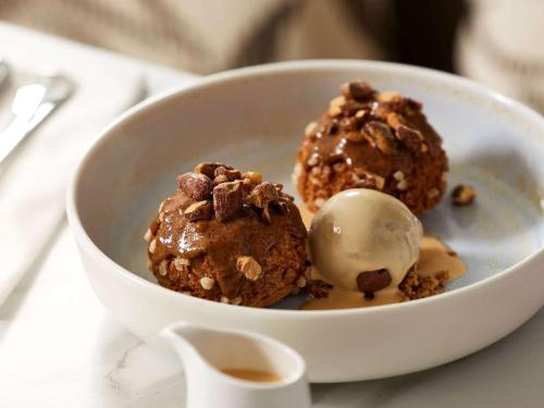 two chocolate muffins in a bowl with a scoop of ice cream at Domaine du Liziec Vannes - MGallery Collection in Vannes