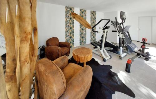 a living room with a gym with exercise equipment at Lovely Home In Cuers With Kitchen in Cuers