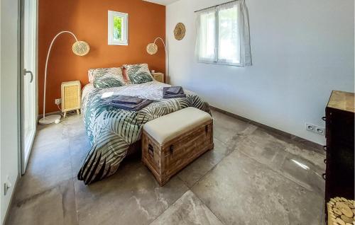 a small bedroom with a bed and a window at Lovely Home In Cuers With Kitchen in Cuers