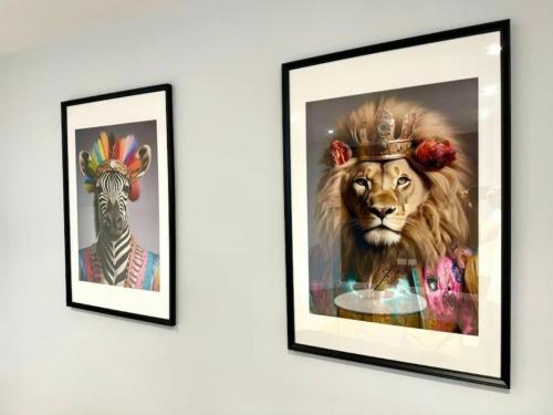 a painting of a lion and a zebra on a wall at Ground Floor - Near the Beach - 3 Bedroom - New - in Bournemouth