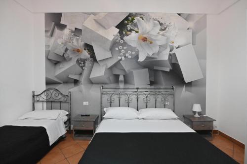 Una cama o camas en una habitación de B&B L'Infiorescenza new