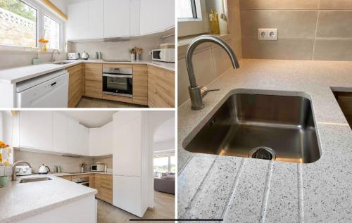 a kitchen with white cabinets and a stainless steel sink at Luxury 2 Bedroom Villa on Quinta da Saudade in Pêra
