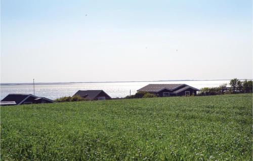 a field of green grass with houses in the background at Apartment Esbjerg V With Patio Vi in Sjælborg